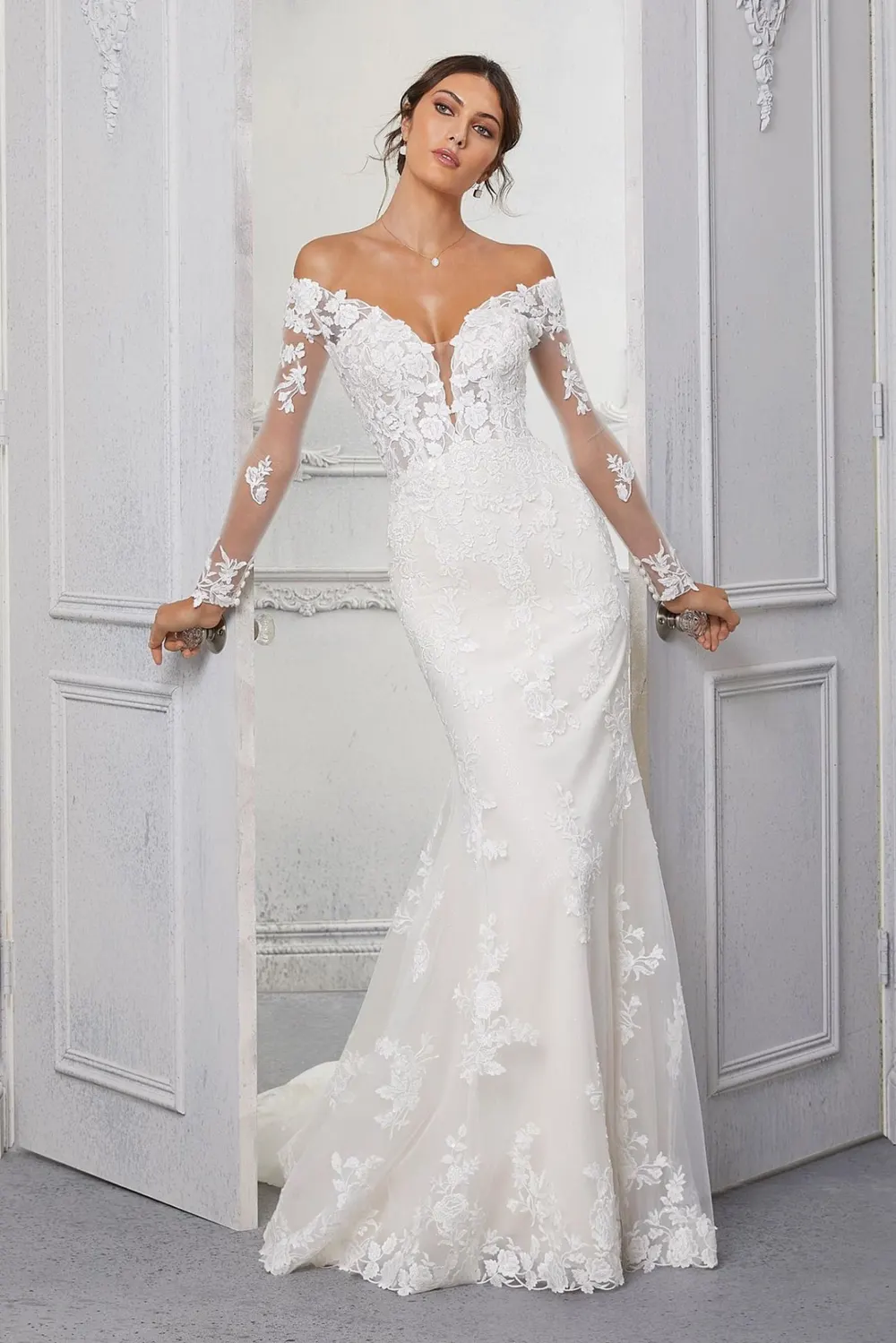 Off-the-shoulder lace fishtail wedding gown with sheer lace sleeves, part of The Bridal Edit at SNOB in Eccleshall