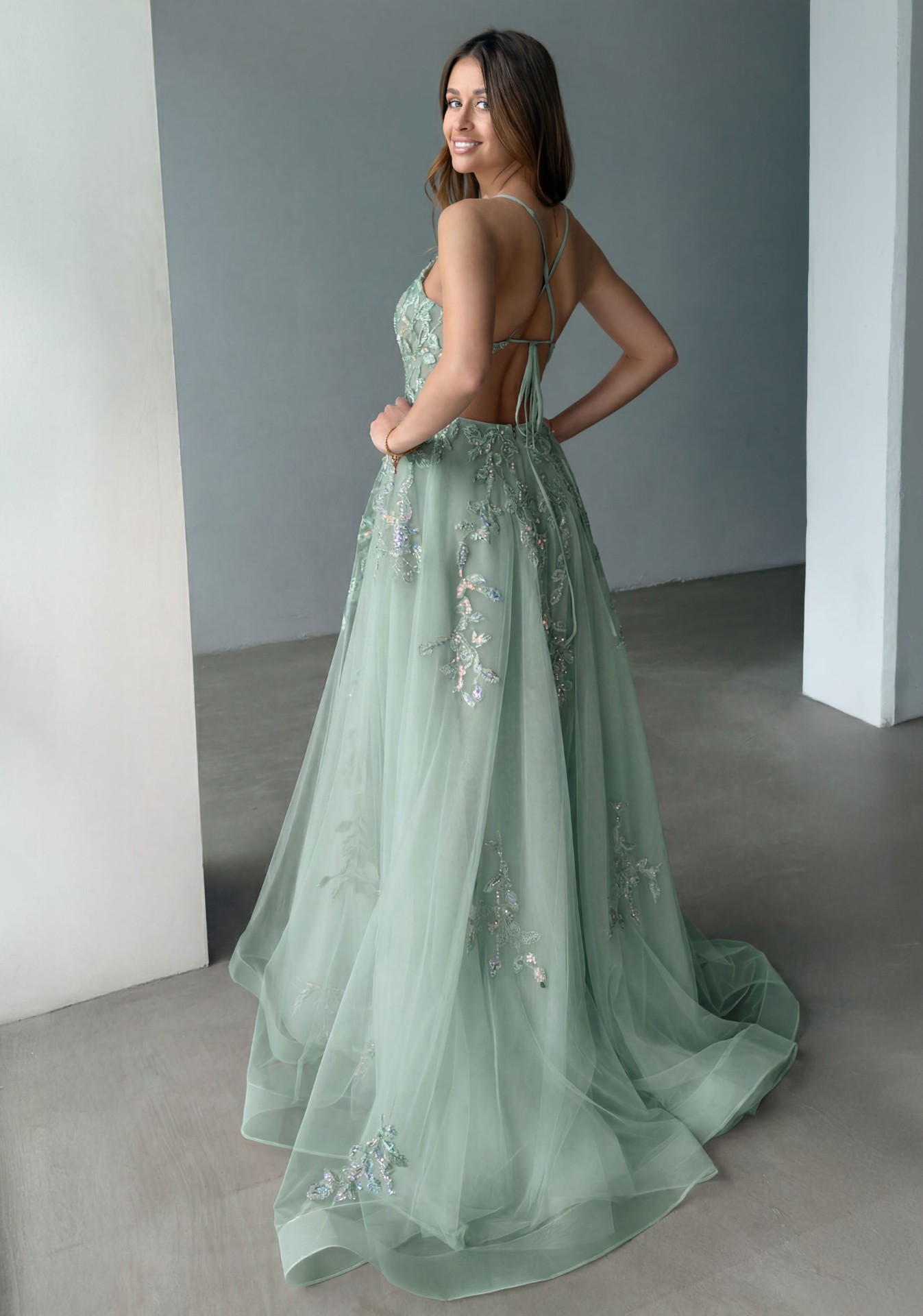 Woman wearing Style 1266 Dusty Green evening dress — back view
