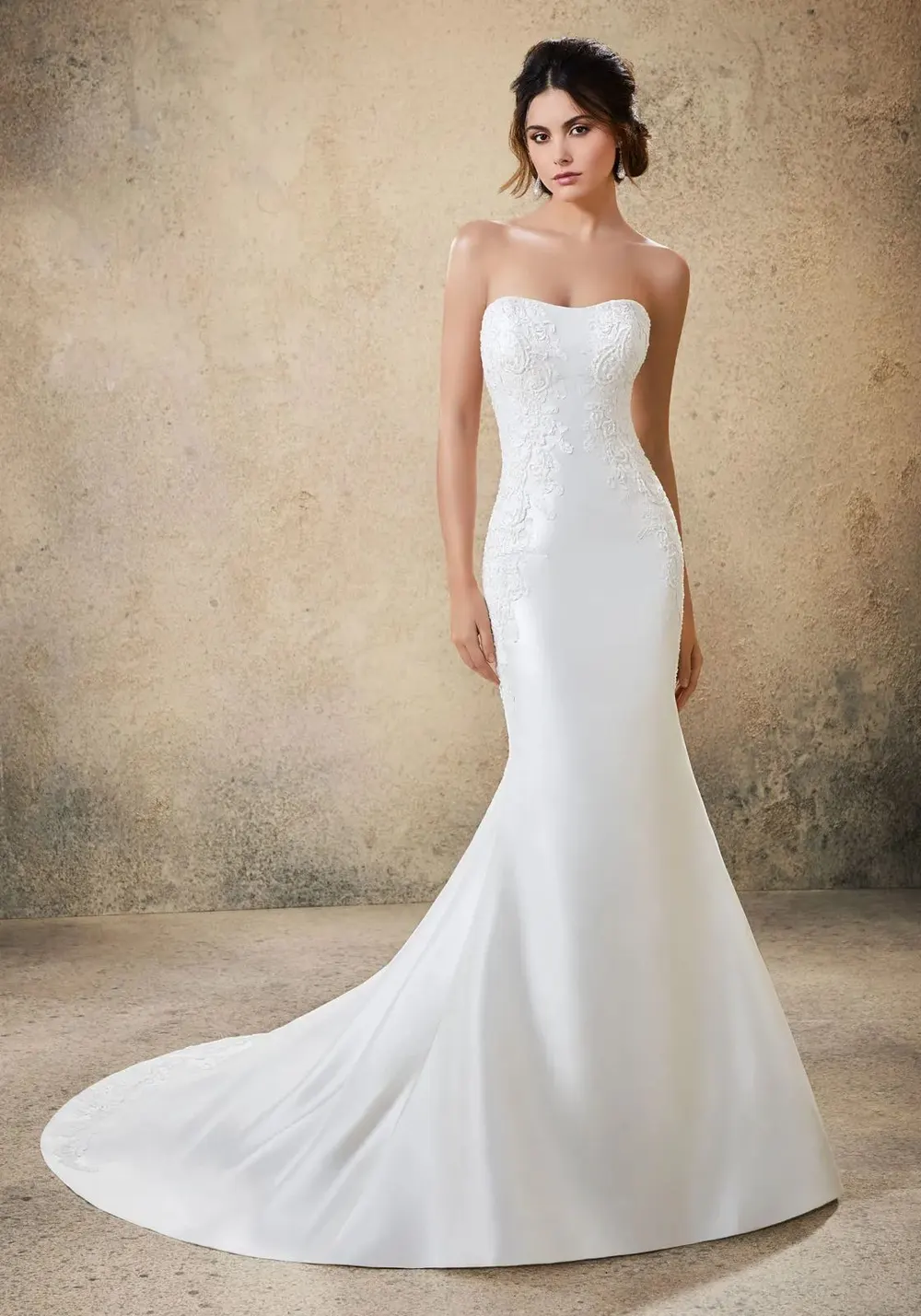 Strapless sculpted wedding gown with soft lace bodice detail and a smooth fitted skirt, part of The Bridal Edit at SNOB in Eccleshall