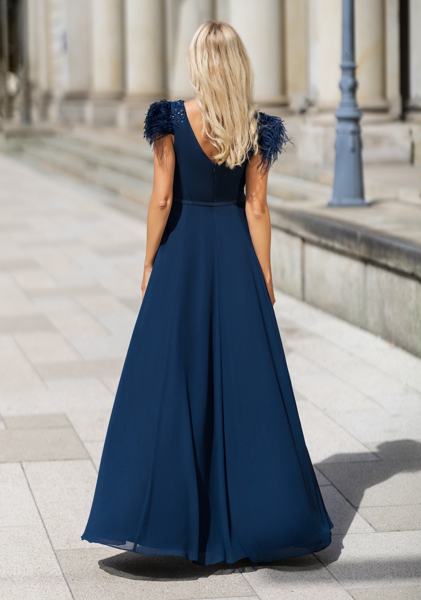 Woman wearing Style 0848 Twilight Blue evening dress — back view