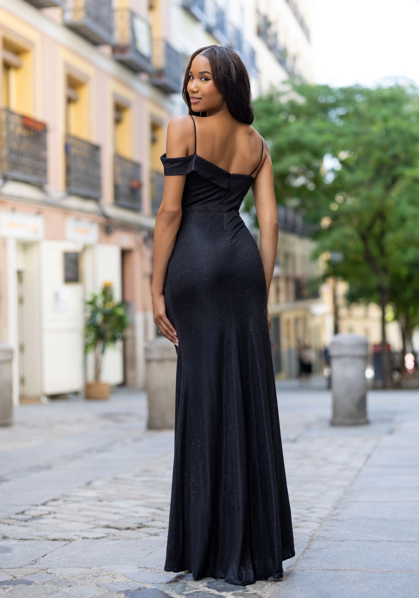 Woman wearing Style 1086 Glitter Black evening dress — back view