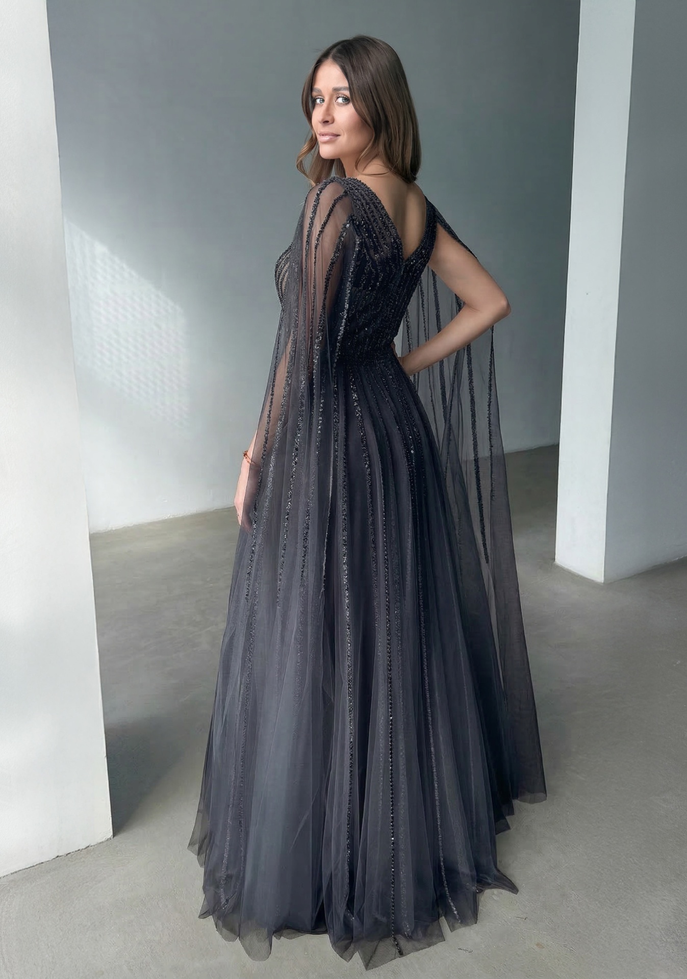 Woman wearing Style 1254 Phantom Black evening dress — back view