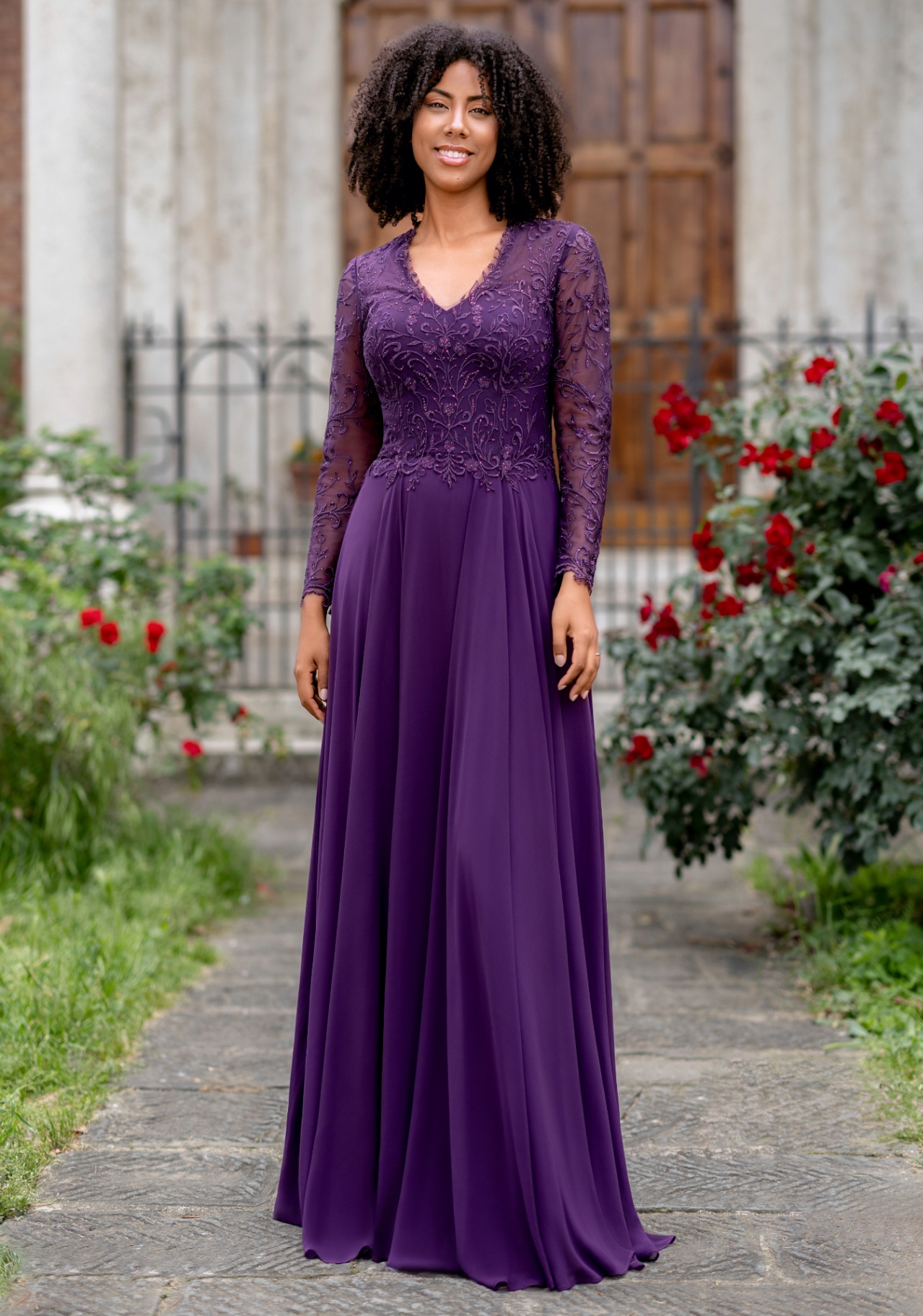Woman wearing Style 1029 Blackberry Purple evening dress