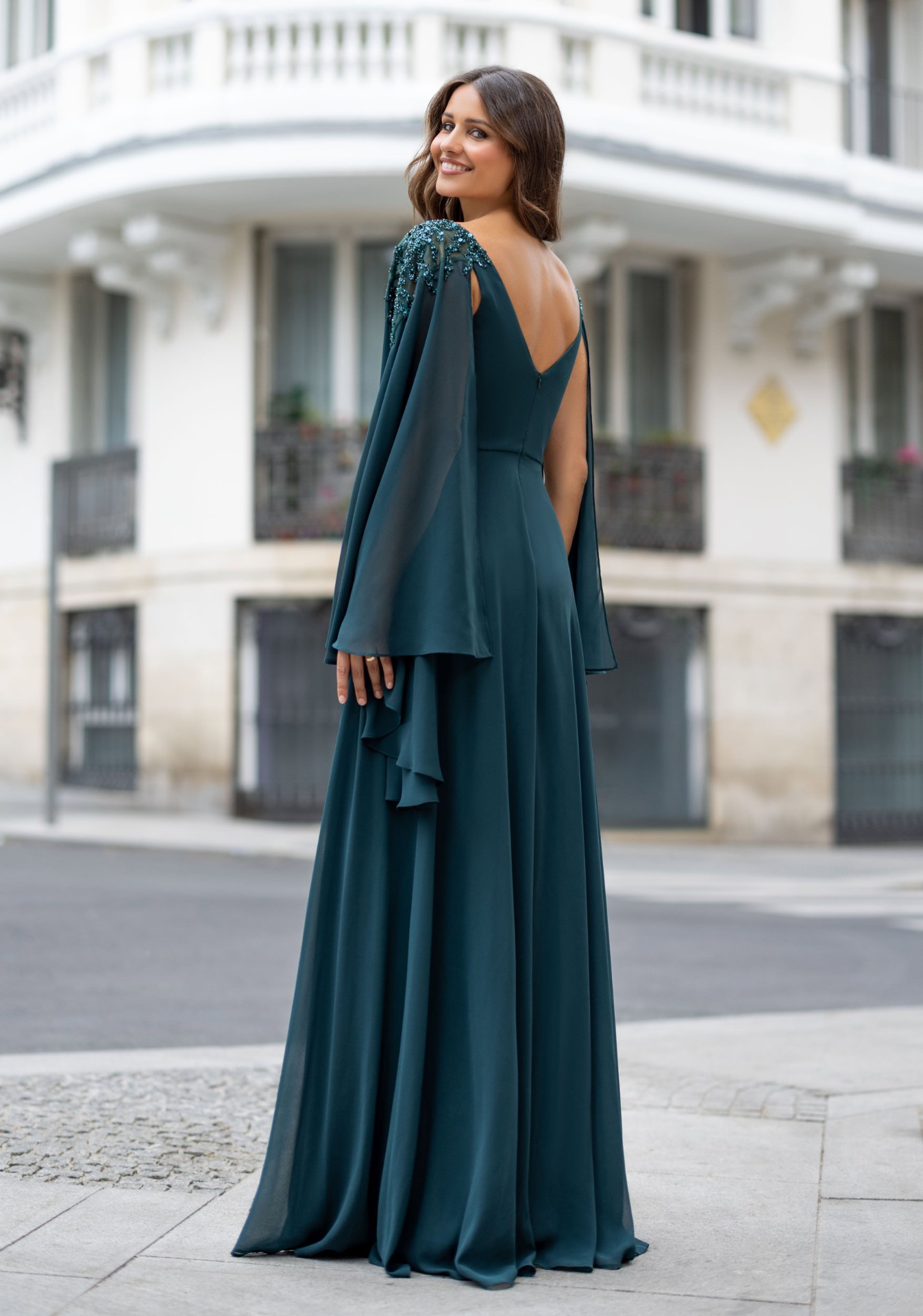 Woman wearing Style 1099 Botanical Green evening dress — back view